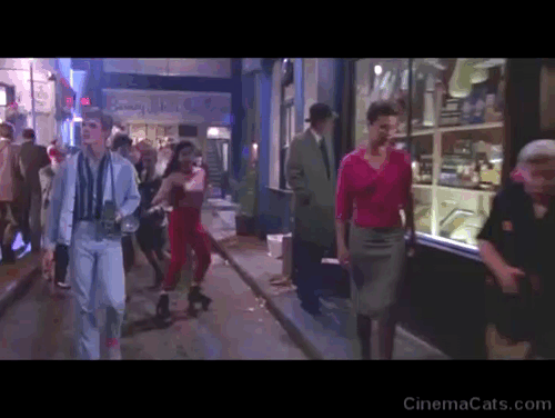 Absolute Beginners - black cat being tossed into streets in front of Colin Eddie O'Connell twice animated gif