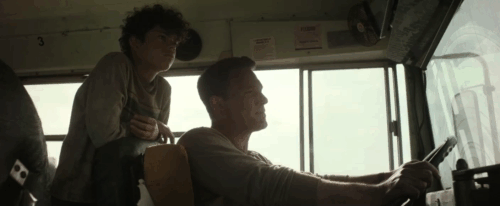 The Accountant 2 - Braxton Jon Bernthal rescuing ginger tabby cat in front of bus as Christian Ben Affleck and Alberto Yael Ocasio watch animated gif