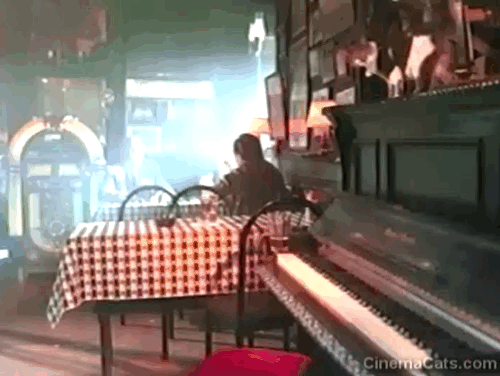 Across the Sea of Time - calico cat on top of bar piano jumping down to table animated gif