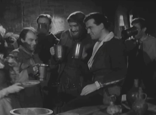 The Adventures of Robin Hood - The Borrowed Baby - tabby kitten being toasted by Robin Hood Richard Greene and his men with Alison Sylvia Kay animated gif