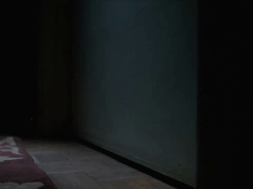 Agatha Christie’s Miss Marple - The Murder at the Vicarage - tabby cat being moved aside by person blocking door with coverlet animated gif