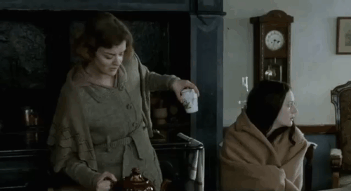 Angel - Romola Garai and Nora Lucy Russell in kitchen with white, black, silver tabby, longhair white Persian cats animated gif