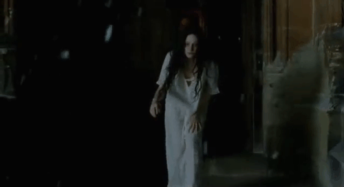 Angel - Romola Garai picking up shorthair white kitten Silky Boy from snow animated gif