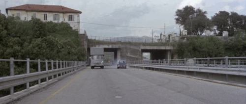 La banda del gobbo - Brothers Till We Die - black cat running across road in front of Vincenzo Tomas Milian's car animated gif