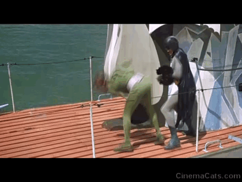 Batman the Movie - Batman Adam West holding black cat Hecate while fighting Riddler Frank Gorshin on top of submarine animated gif