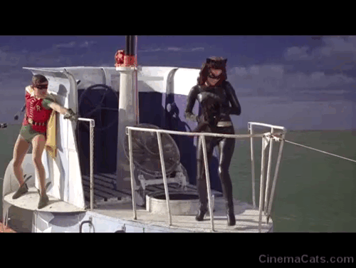 Batman the Movie - Catwoman Lee Meriwether dropping black cat Hecate to Batman Adam West as he fights Joker Cesar Romero and Penguin Burgess Meredith on top of submarine animated gif
