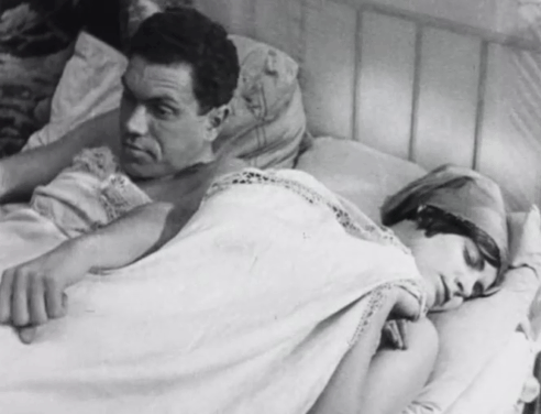 Bed and Sofa - tabby cat being pushed in Liuda Lyudmila Semyonova face by Kolia Nikolay Batalov in bed animated gif