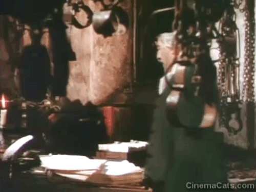 The Beggar's Opera - black cat on desk with Mr. Lockit Stanley Holloway animated gif