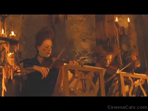 The Brothers Grimm - ginger tabby kitten coming out from beneath musician's skirt and crossing dungeon to Cavaldi Peter Stormare animated gif