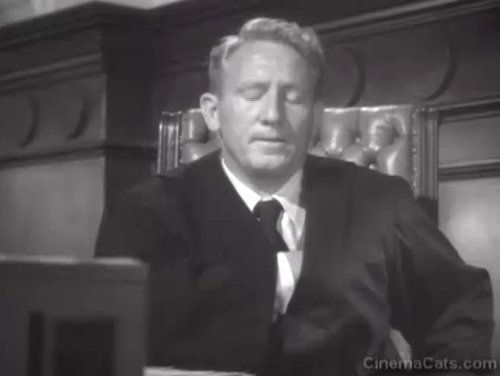Cass Timberlane - Spencer Tracy as judge on bench sneezing at gray and white cat animated gif