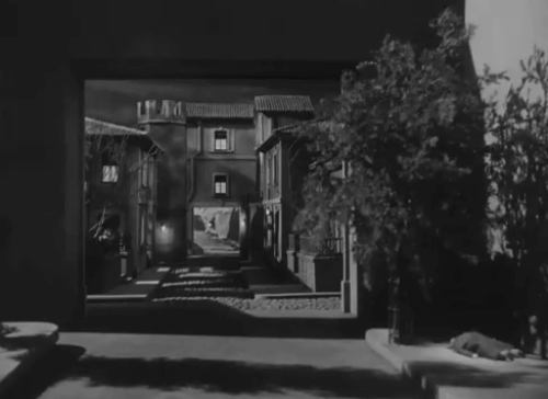 The Catman of Paris - black kitten walking through miniature Paris street prodded away with pointer by Severen Gerald Mohr with prefect Fritz Feld animated gif