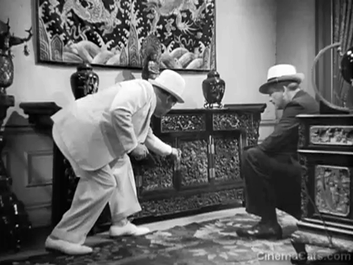 Charlie Chan in Shanghai - Charlie Chan Warner Oland and James Andrew Russell Hicks finding kittens in cabinet animated gif
