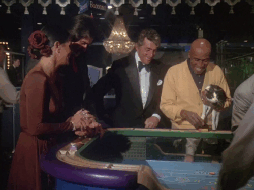 Charlie's Angels - Angels in Vegas - Frank Dean Martin at craps table with Jip Scatman Crothers holding interested tuxedo cat animated gif