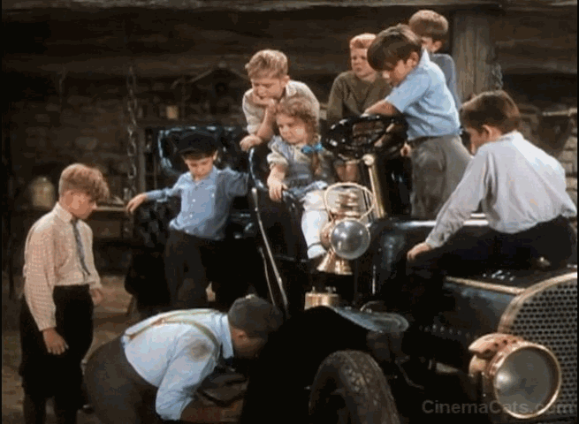 A Connecticut Yankee in King Arthur's Court - Hank Martin Bing Crosby pulls orange cat out of automobile engine animated gif