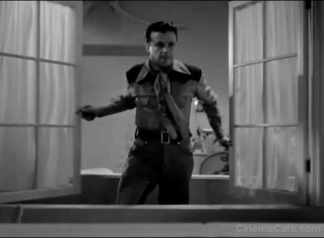 Cowboy from Brooklyn - black cat on hotel railing scares Dick Powell animated gif