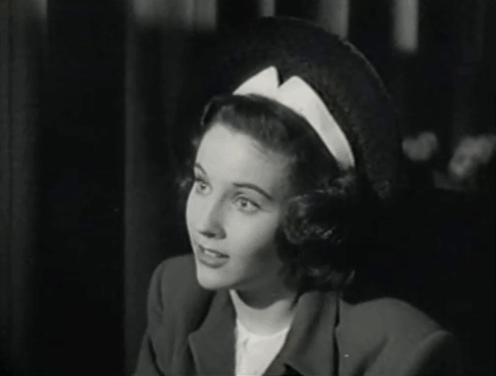 The Creeper - Nora Janis Wilson startled by black cat jumping onto booth beside her animated gif