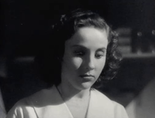 The Creeper - Nora Janis Wilson terrified by black cat with white paw Creeper sitting in front of her animated gif