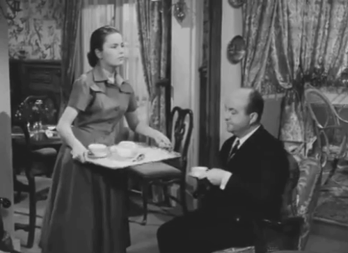 Crime et chatiment - tabby cat on couch behind Nicole Ulla Jacobson animated gif