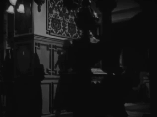 Death Walks in the Rain - La muerte camina en la lluvia - longhair tabby cat hugged by Valeria Duval Margarita Corona animated gif