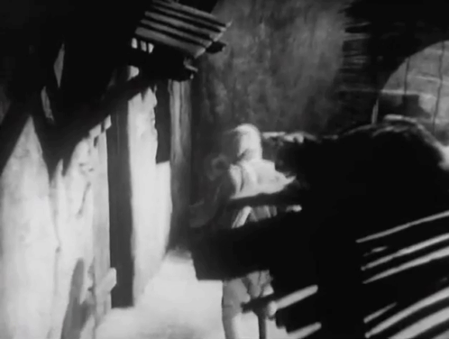 The Devil's in Love - tabby cat on roof above Captain Radak C. Henry Gordon and thug animated gif