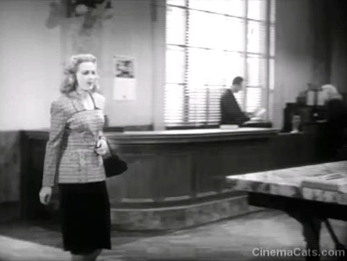 Dick Tracy Meets Gruesome - Tess Trueheart Anne Gwynne smiling at tabby cat on counter before guard Harry Harvey has janitor chase after cat animated gif
