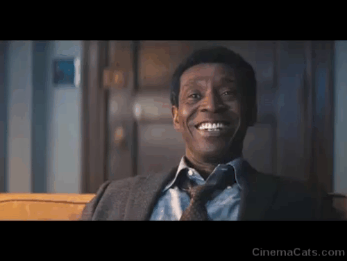 Don't Look Up - Dr. Teddy Oglethorpe Rob Morgan sitting on couch with longhaired tabby and white cat Squiggy animated gif