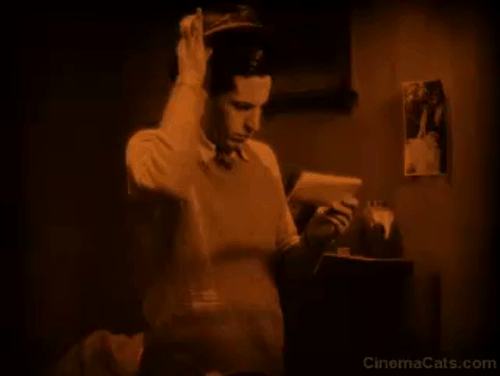 Downhill - Roddy Ivor Novello throws down hat and startles black cat animated gif