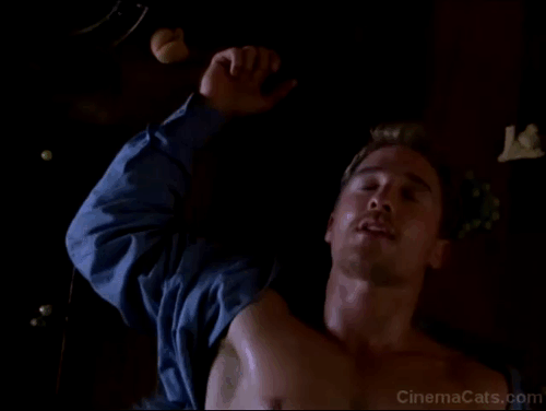 EDtv - Jill Elizabeth Hurley looking down at Ed Matthew McConaughey laying on floor with grey and white Persian cat Isabella's tail sticking out animated gif