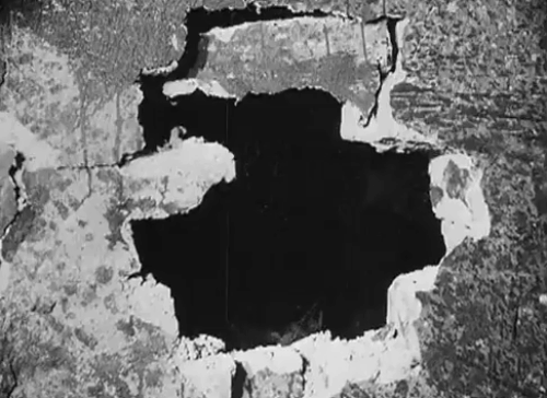 Eerie Tales - Unheimliche Geschichten - black cat emerging from hole in wall animated gif