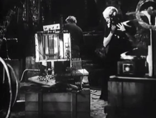 Eerie Tales - Unheimliche Geschichten - Betty Roma Bahn dropping black cat onto experimental equipment startling Morder Paul Wegener animated gif