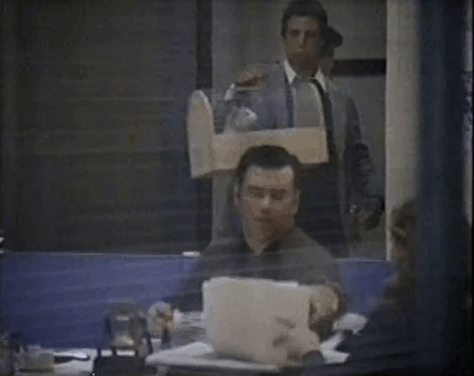 Eischied - Only the Pretty Girls Die - Detective Alessi Vincent Bufano carrying ginger and white tabby cat P.C. Waldo Kitty in carrier through precinct animated gif