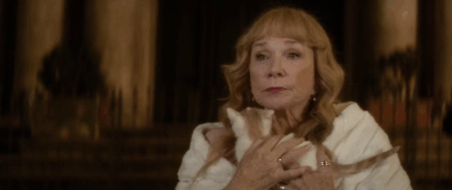 Elsa and Fred - Shirley Maclaine holding ginger and white kitten as she looks at Trevi Fountain animated gif