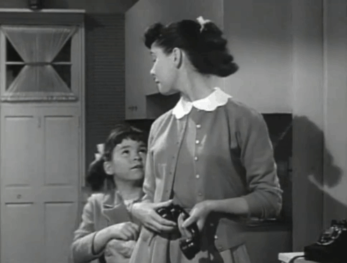 Father Knows Best - Kathy Makes Magic - Lauren Chapin holding tabby kitten Fluffy while taking phone from Betty Elinor Donahue animated gif