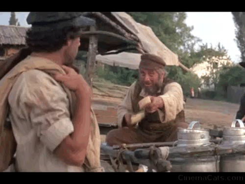 Fiddler on the Roof - Perchik Paul Michael Glaser accepting cheese with cat in background animated gif