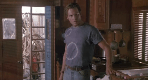 Fires Within - Sam Vincent D'Onofrio picking up and putting tuxedo cat outside of boat cabin animated gif