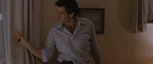 The Fourth Protocol - boy trying to reach ginger cat on top of pergola as Petrofsky Pierce Brosnan watches out window animated gif