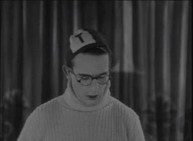 The Freshman - kitten pokes its head out of Harold's collar animated gif