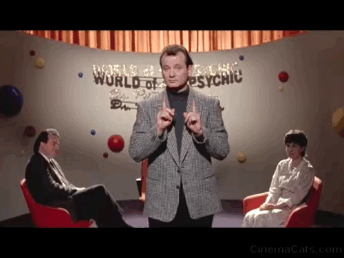 Ghostbusters II - Peter Venkman Bill Murray holding up hairless Cornish Rex cat on World of the Psychic animated gif