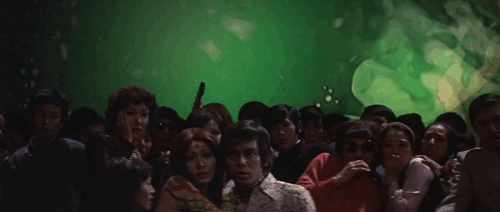 Godzilla vs. Hedorah Smog Monster - white cat sitting in sludge mewing animated gif