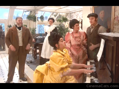 The Goes Wrong Show - Harper's Locket - Bernard Robert Henry Lewis, Celeste Sandra Charlie Russell and Edwin Chris Henry Shields reacting as fake cat attacks Emily Annie Nancy Zamit at piano animated gif