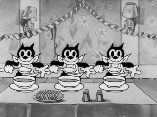 Goopy Geer - three cartoon black cats with soup bowls eating one cracker animated gif