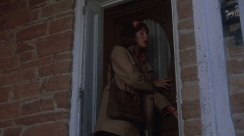 The Grasshopper - Christine Jacqueline Bisset leaving house and pausing to stroke longhair tabby kitten on front step animated gif