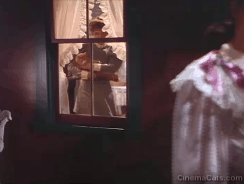 The Harvey Girls - Sonora Cassidy Marjorie Main putting orange and white tabby cat Arabella out through window animated gif
