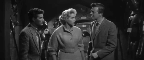 The Headless Ghost - Bill Richard Lyon picking up longhair black cat in castle with Ingrid Liliane Sottane and Ronnie David Rose animated gif