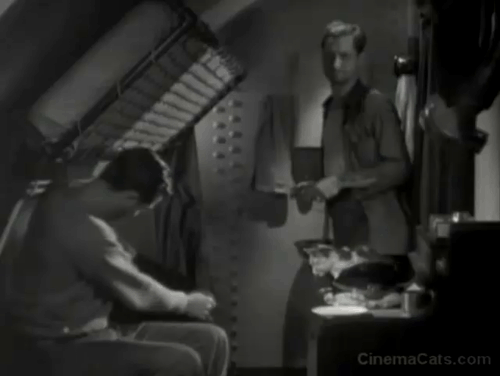 Hell Below - Robert Montgomery takes calico out of hat and hands it to Robert Young then throws hat animated gif