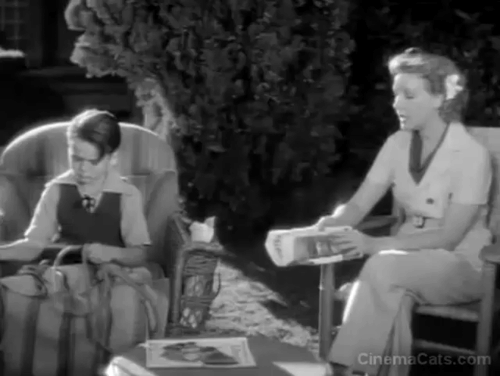 Hollywood Roundup - gray and white cat walks behind Carol Helen Twelvetrees and Dickie Jones animated gif