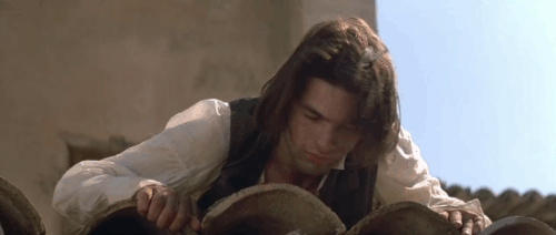 Le Hussard sur le Toit - The Horseman on the Roof - brown tabby cat lying on tiled rooftop with Angelo Olivier Martinez animated gif