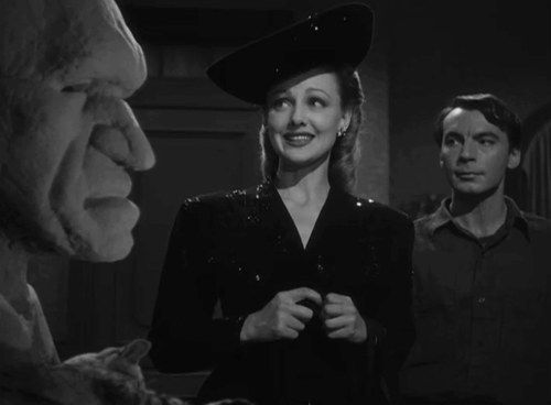 House of Horrors - Marcel Martin Kosleck with Joan Virginia Grey looking at bust as grey tabby cat Pietro preens animated gif