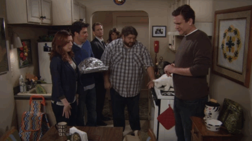 How I Met Your Mother - Blitzgiving - Lily Alyson Hannigan, Ted Josh Radnor, Barney Neil Patrick Harris, Robin Cobie Smulders, Marshall Jason Segel and Steve Jorge Garcia in kitchen with white cat and tabby cat on counter and ginger tabby in oven animated gif