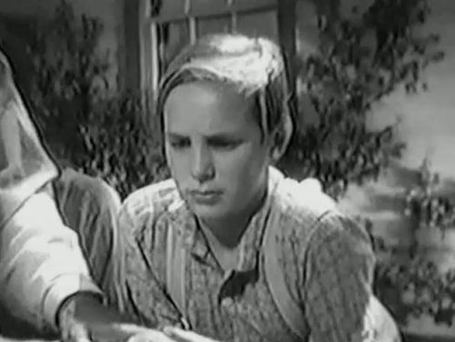 Huckleberry Finn - Tom Sawyer Jackie Coogan looking excited then disappointed about tuxedo cat on white picket fence animated gif